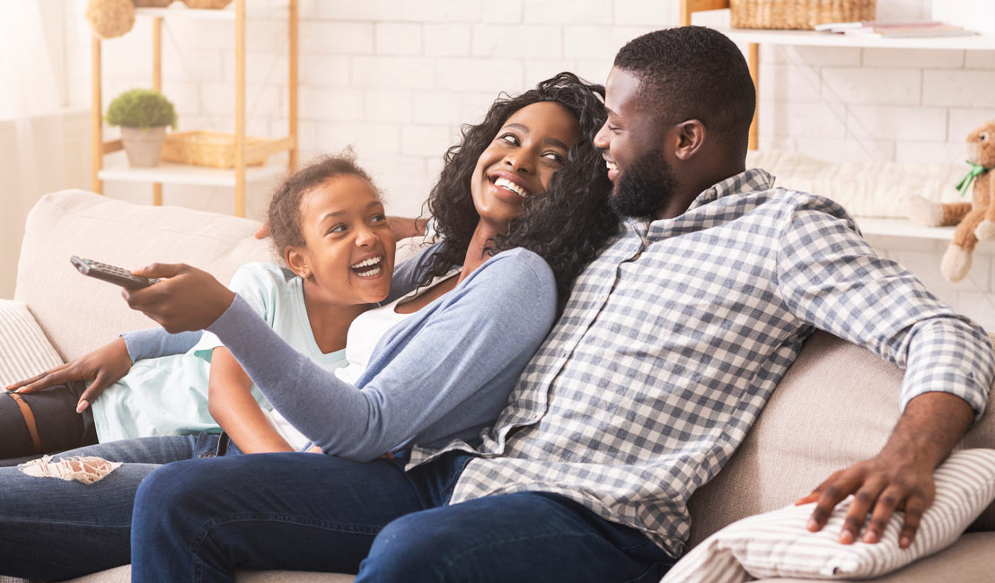 Family sitting together on the couch